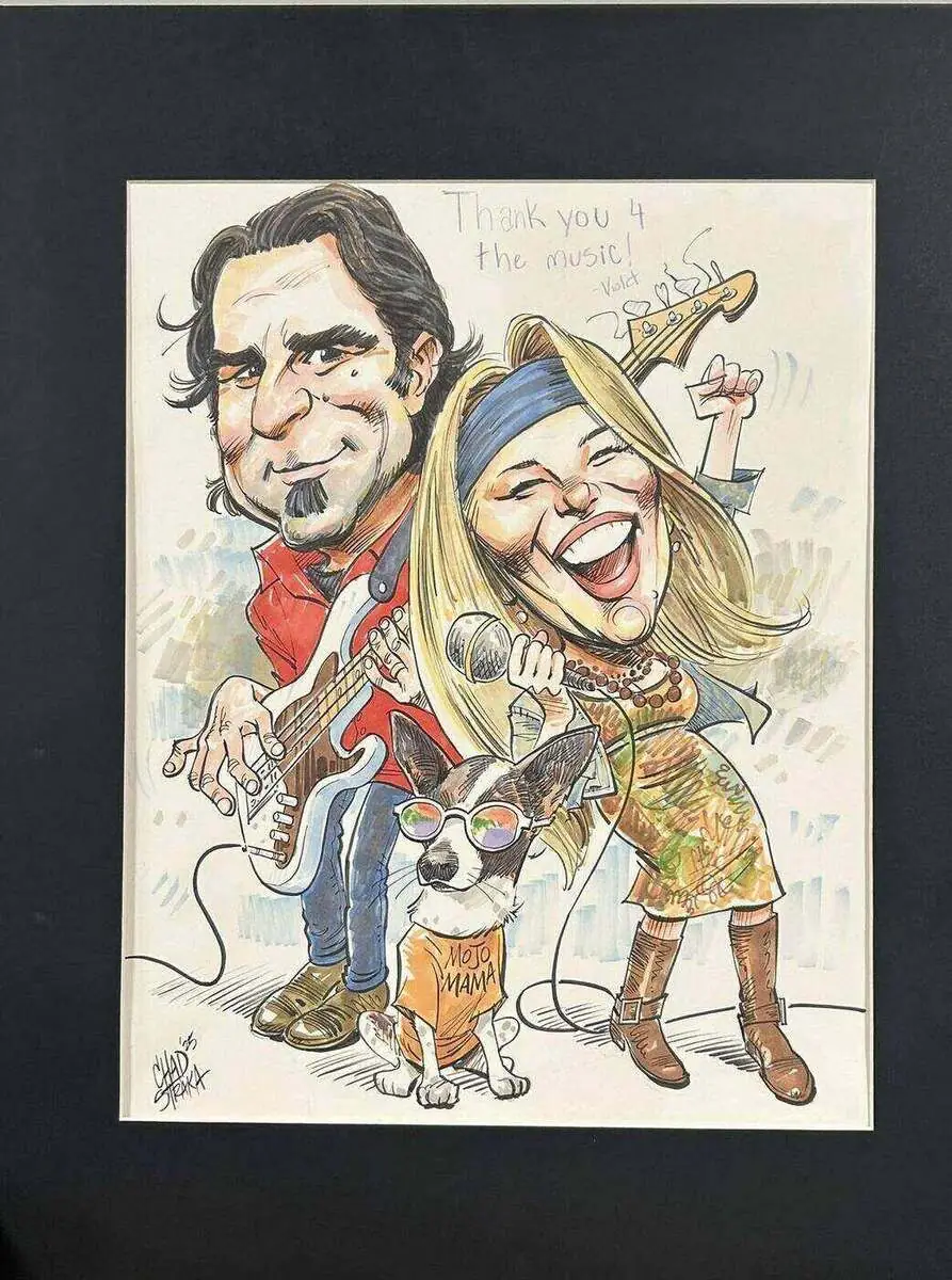 A hand-drawn caricature of Jessica and Paul Rogalski performing with Koko, the Mojo's Music Academy mascot dog, on the wall at Mojo's Music Academy