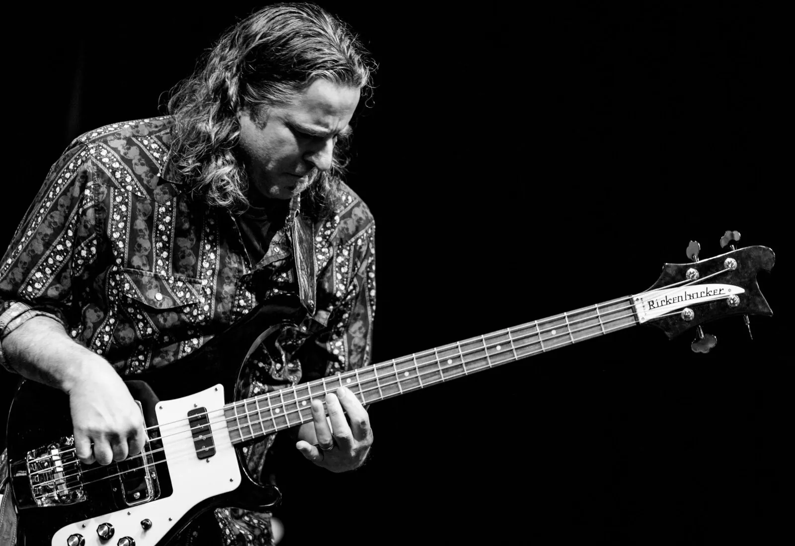 Paul Rogalski playing bass guitar on stage, bass teacher and co-founder at Mojo's Music Academy